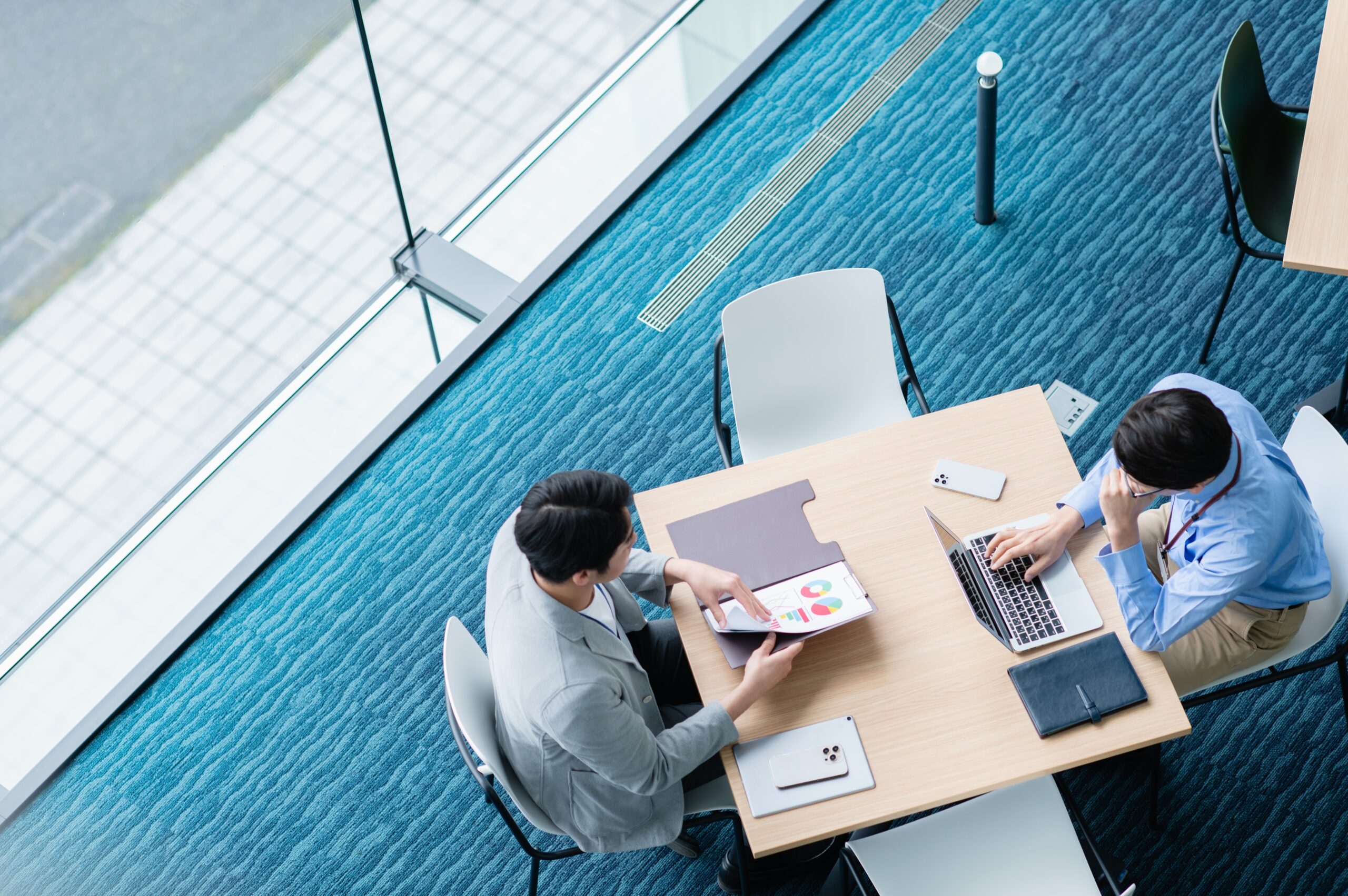 A professional meeting a client face-to-face