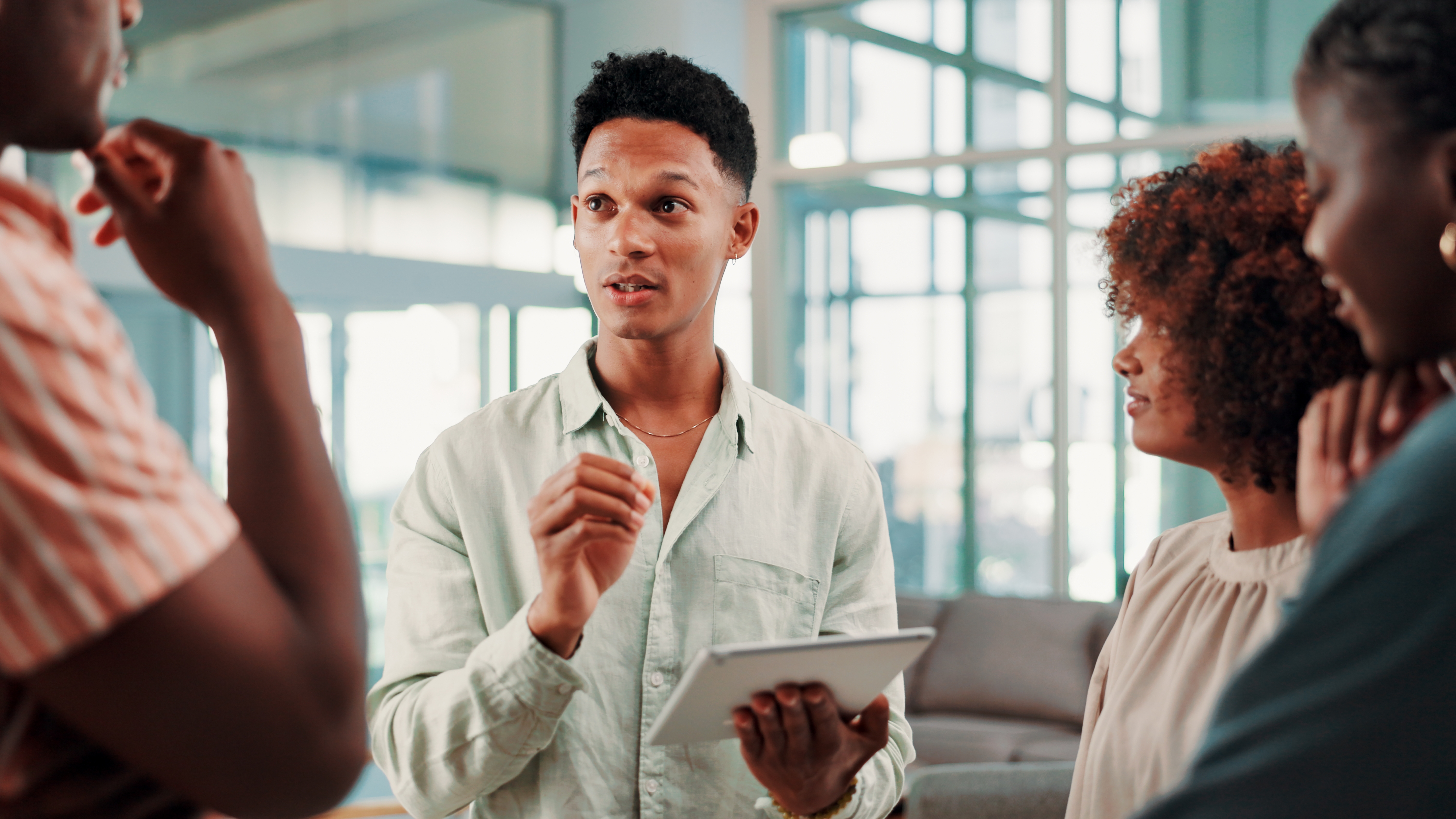 An event coordinator talking to his team