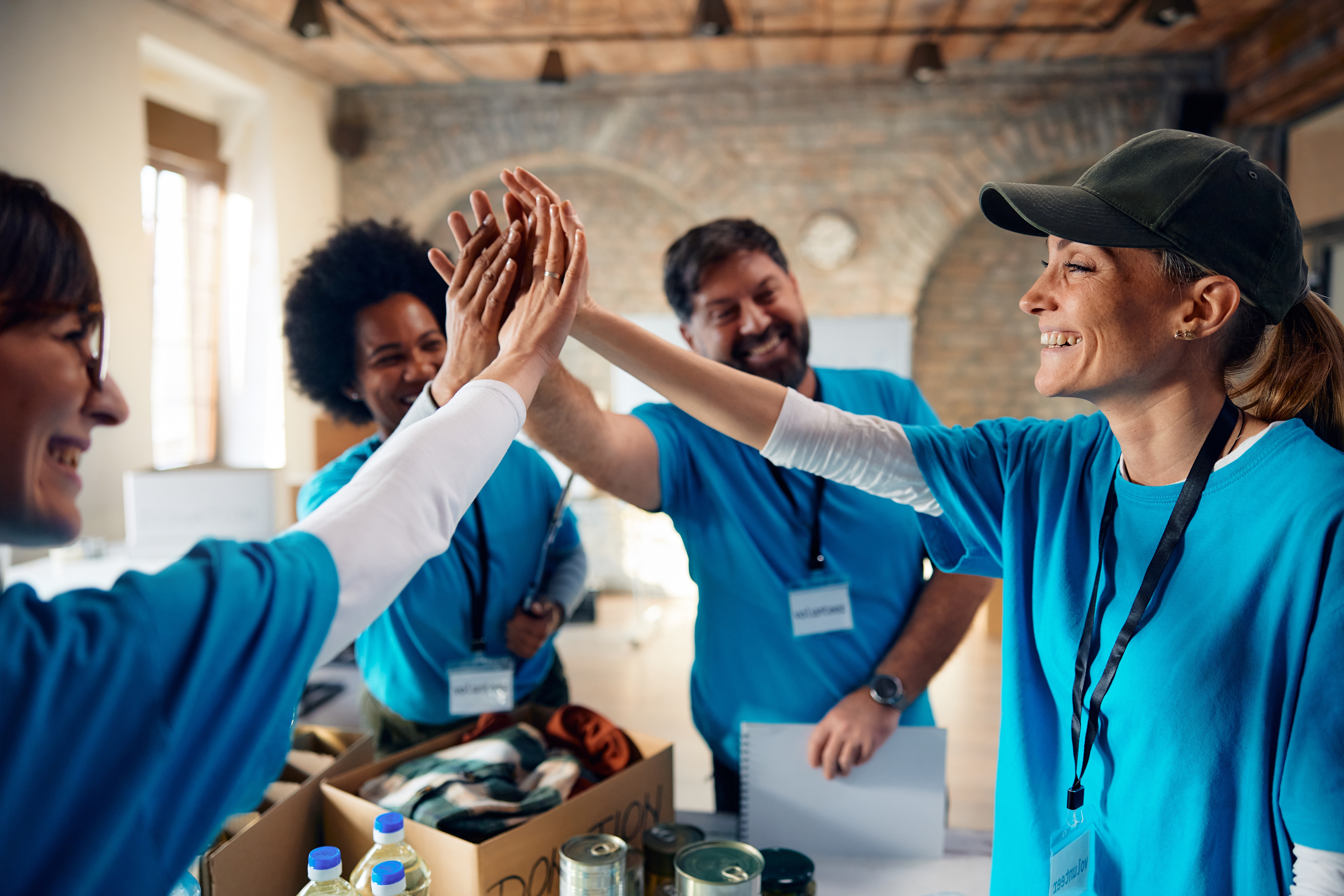 A team of nonprofit workers giving high-fives